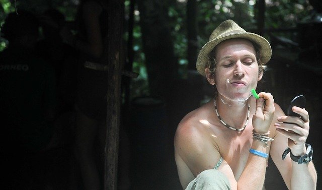 man shaving outdoors