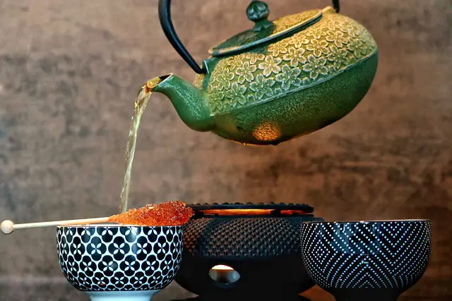 Darjeeling Tea being poured from a green pot