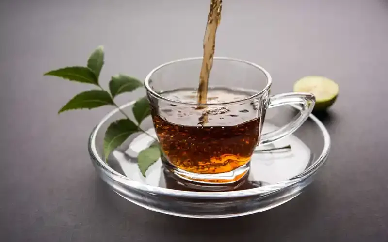 herbal-neem-tea poured into a glass mug