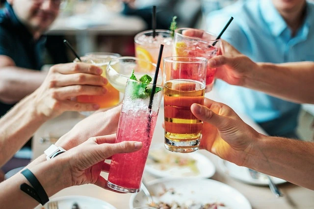 a group toasting cocktails